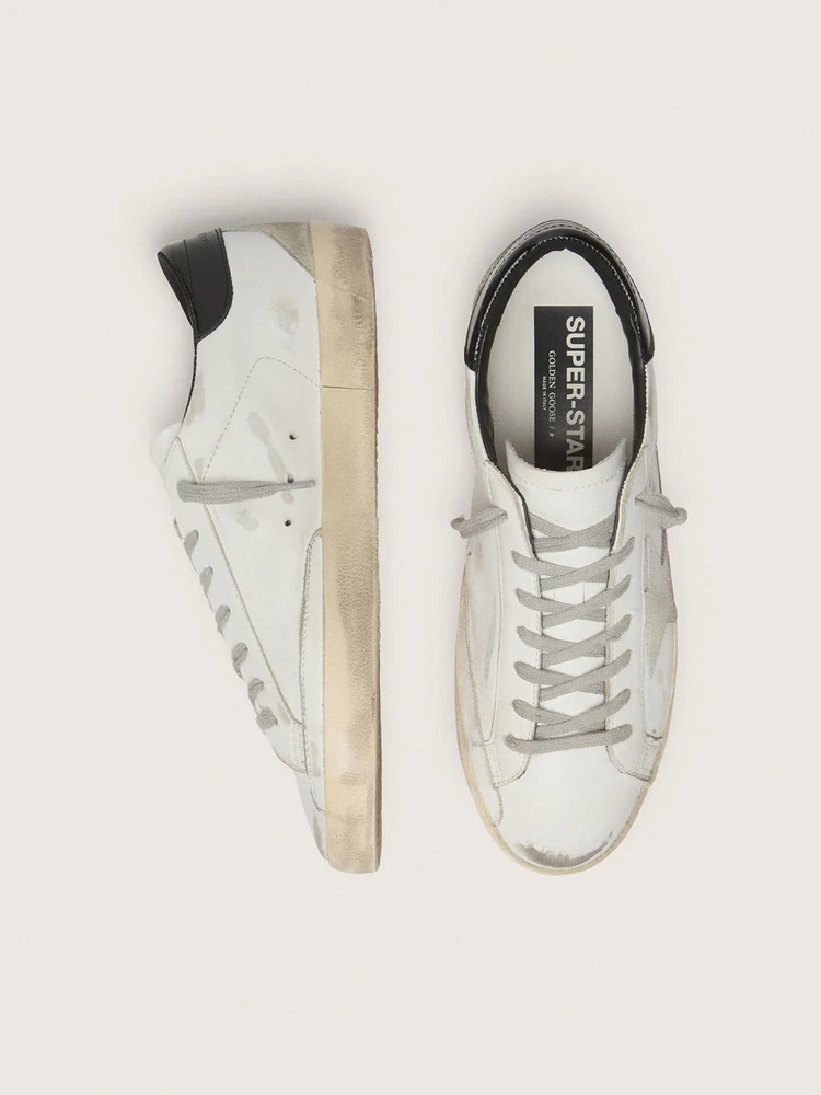 Golden Goose Super-Star with black heel tab and metal stud lettering, деталь