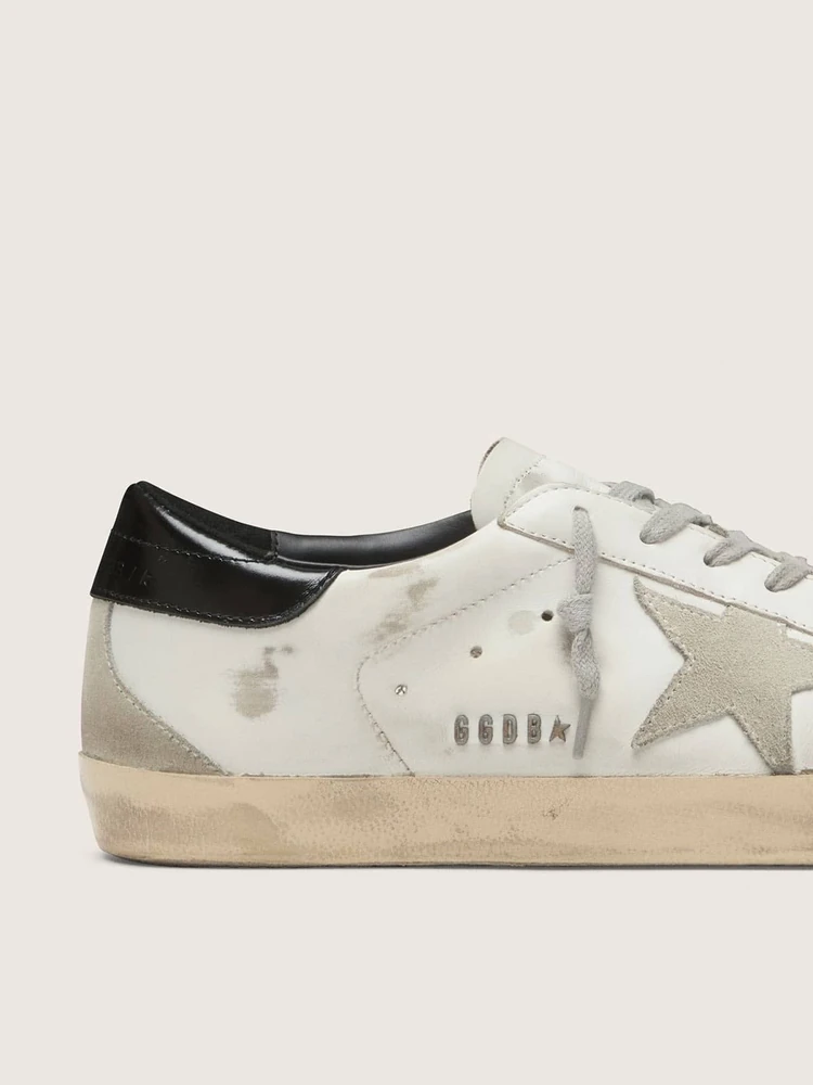 Golden Goose Super-Star with black heel tab and metal stud lettering, деталь